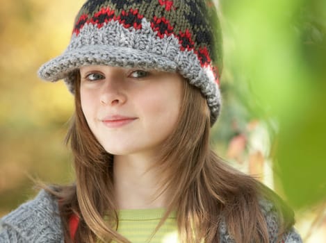Head And Shoulders Of Young Girl In Autumn Woodland