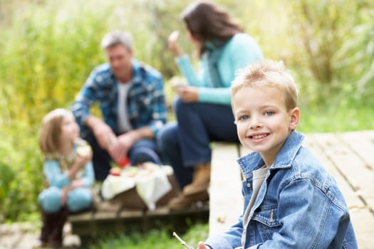 Parents And Children Having Picnic In Countryside