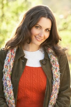 Portrait Of Woman Outdoors In Autumn Landscape