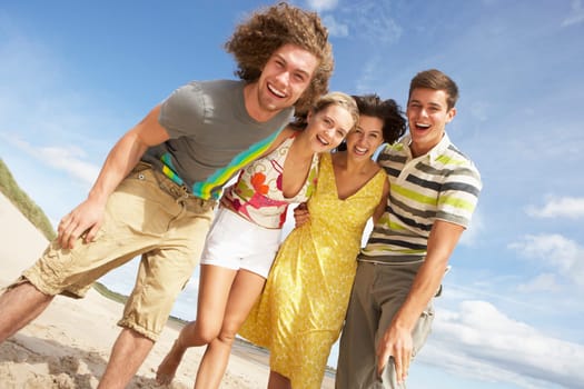 Group Of Friends Having Fun On Summer Beach
