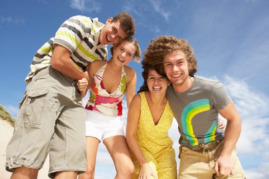 Group Of Friends Having Fun On Summer Beach