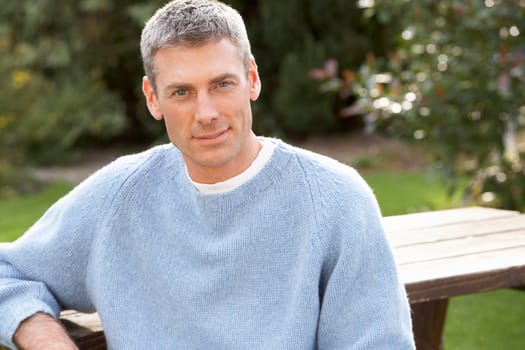 Close Up Portrait Of Man Standing Outside In Autumn Landscape