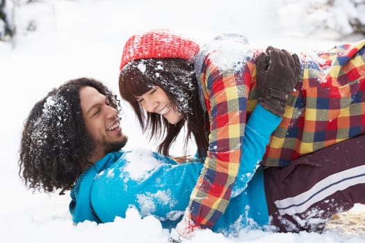 Romantic Teenage Couple Having Fun In Snow