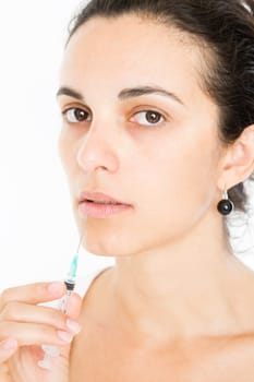 Woman getting lips injected