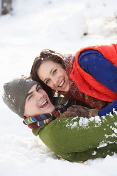 Romantic Teenage Couple Having Fun In Snow