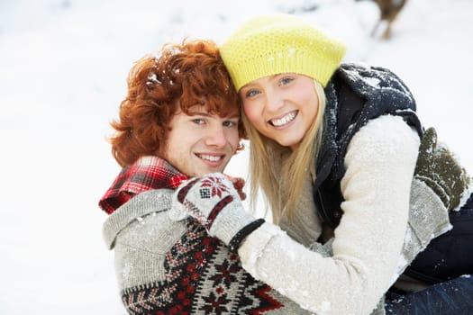 Romantic Teenage Couple Having Fun In Snow