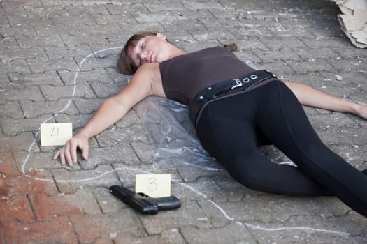killed woman outlined on the ground