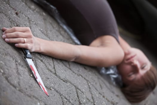crime scene with unconscious woman