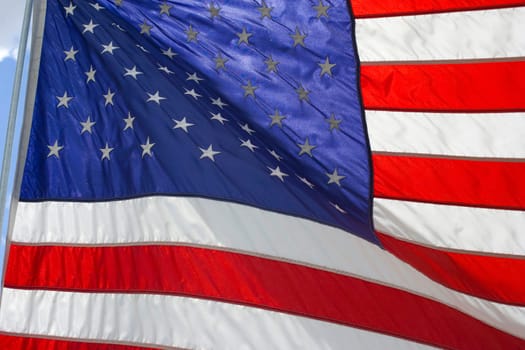 American Flag curls and flaps with a strong breeze