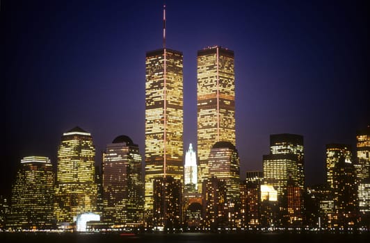 New York City skyline with the World Trade Center towers at night. Horizontal shot.