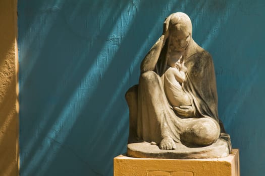 stone statue of the virgin mary holding jesus, buenos aires, argentina