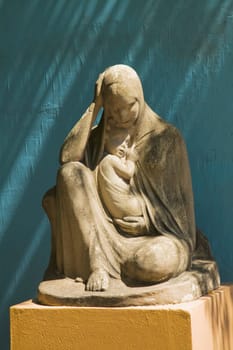 stone statue of the virgin mary holding jesus, buenos aires, argentina