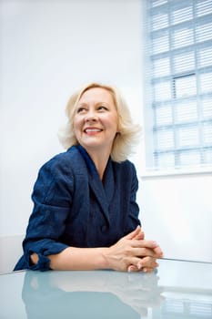 Portrait of Caucasian middle aged businesswoman smiling.