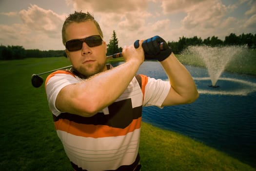Portrait of young male golfer