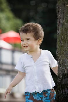 Little boy playing outside