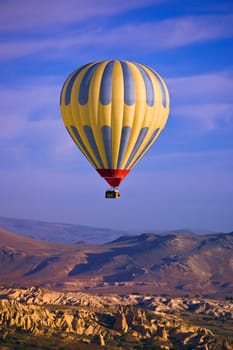 Hot air balloon over Goreme valley, Cappadocia, Anatolia, Turkey