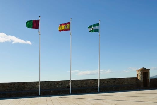 Spanish flags on Gibralfaro Castle, Malaga, Spain