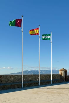 Spanish flags on Gibralfaro Castle, Malaga, Spain