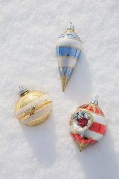 Christmas ornaments in snow