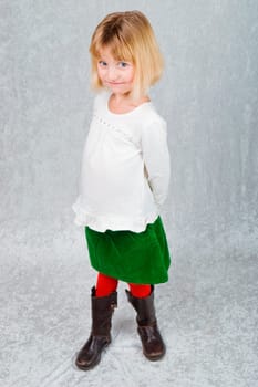 a young girl dressed for christmas