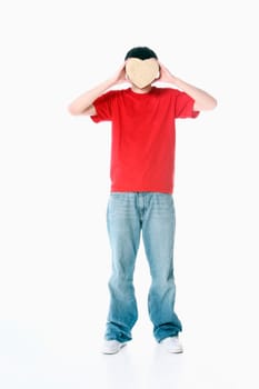 a boy with a heart covering his face