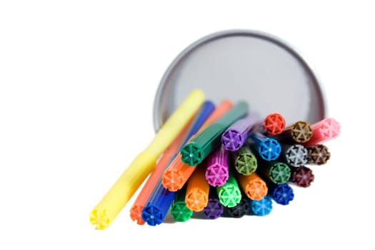 Markers lying in pencil holder.