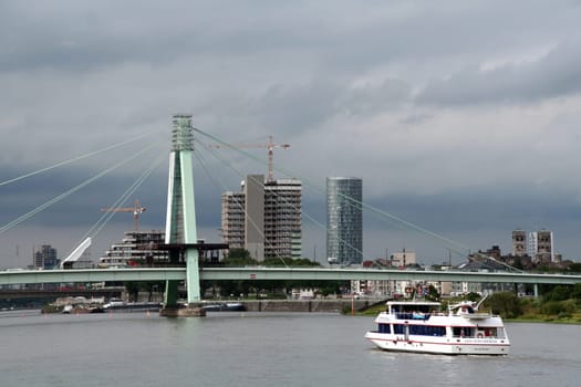 Excursion boat in front of the Severins Bridge
