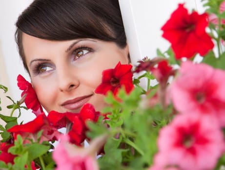 Attractive young woman face with flowers