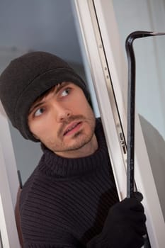 robber with crowbar