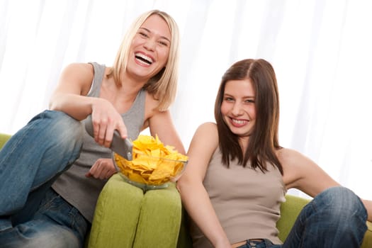 Student - two young woman watch TV