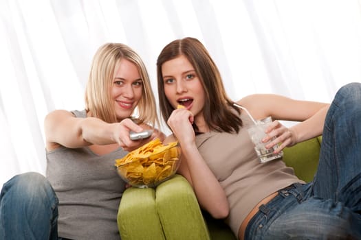 Student - two young woman watch TV