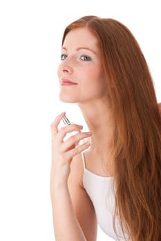 Body care series - Young red hair woman applying perfume