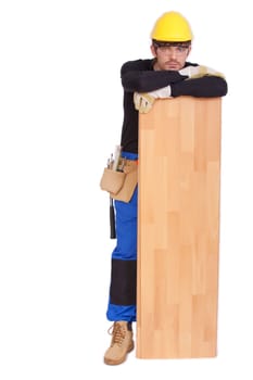 worker with wooden laminate