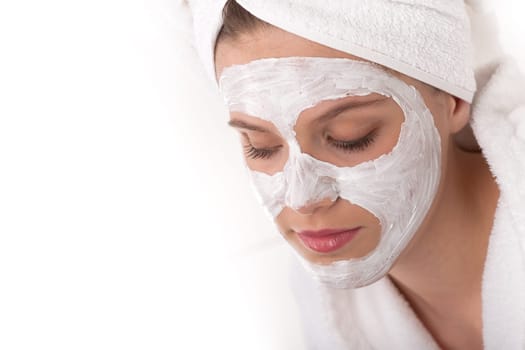 Body care - young woman with facial mask