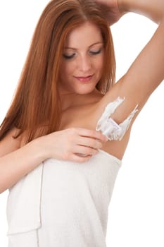 Body care - Smiling red hair woman shaving her armpit