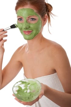 Body care - young woman with facial mask