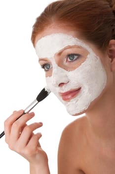 Body care series - Young woman apply facial mask