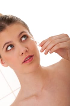 Body care - Young woman cleaning her face