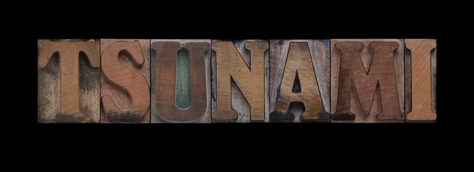 tsunami in old letterpress wood type