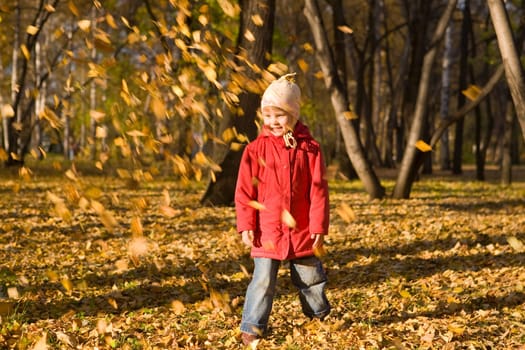 Children throw autumn leaves 2