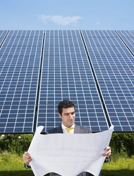 businessman and solar panels