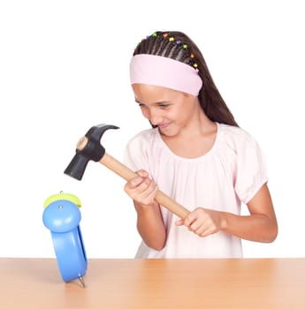 Little girl breaking an alarm clock