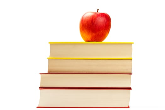 An apple on books