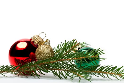 Three baubles between branches