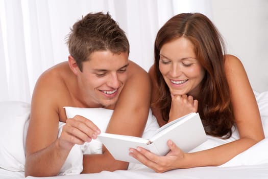 Honeymoon - couple read book in bed