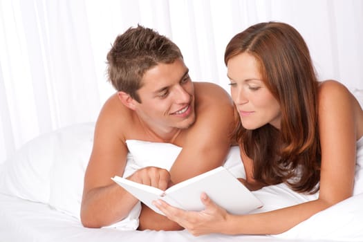 Honeymoon - couple read book in bed