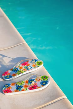 flip-flops near the swimming-pool