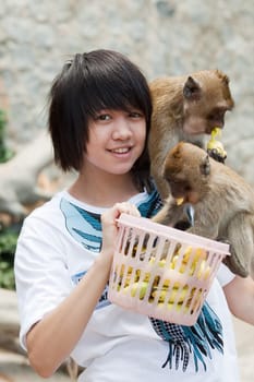Teenager with monkey
