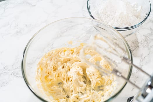 Creating a delectable treat, the process of making homemade cream cheese frosting involves whisking together creamy ingredients to achieve the perfect texture and taste.