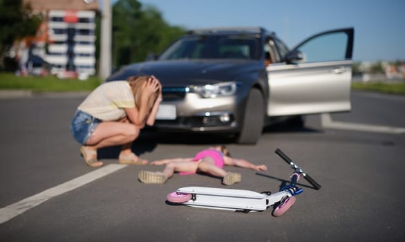 Portrait of girl with scooter hit on road by car, eyewitness worry for child, road accident. Automobile driver hit child. Accident, violation concept